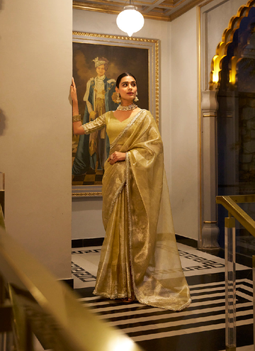Gorgeous Gold Tissue shimmer saree with zari weaving and sequin lace